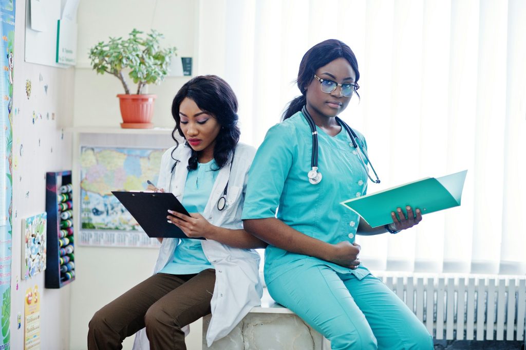 African american pharmacist working in drugstore