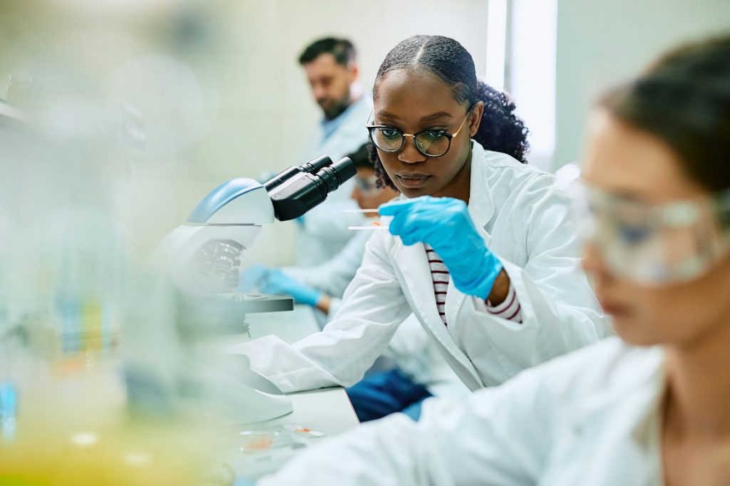 Black female pharmaceutical student during a research in a laboratory.